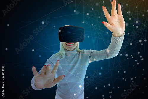 Woman using the virtual reality headset photo