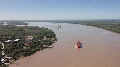 Long Arm Zarate Bridge, located in South America, Argentina, divides the province of Buenos Aires and Entre Rios. below this ship, cargo ships to Brazil and other destinations. photo