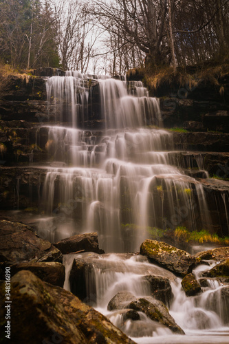 Waterfall in a forest on mountain. Called Tupavica waterfall on old mountain  stara planina  near the village Dojkinci in Serbia