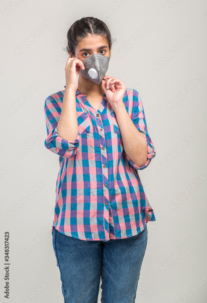A teenage girl wearing N95 mask during covid-19 pandemic in India A teenage girl wearing N95 mask during covid-19 pandemic in India
