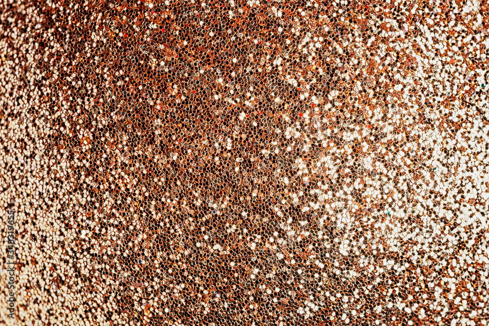 Golden sparkles close up. Bright festive background for sites and layouts Golden sparkles close up. Bright festive background for sites and layouts
