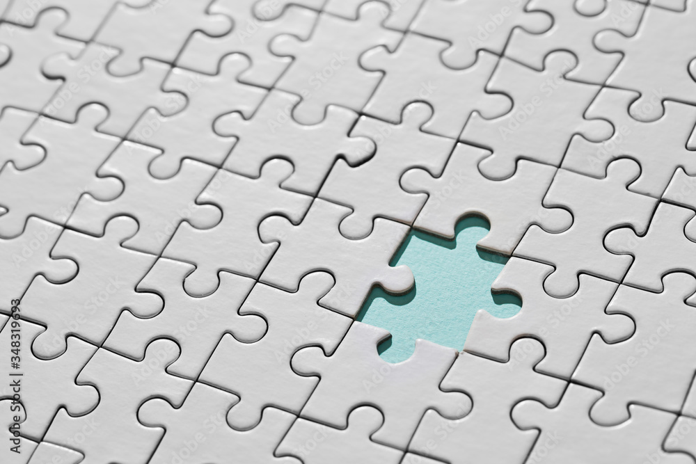 Background of white puzzle with missing piece Background of white puzzle with missing piece