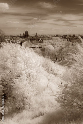 Old Town of Gdansk.  Boy and girl watching panorama from fortress of Gora Gradowa. Green vegetation in infrared (modified DSLR camera). © Fredrixxon