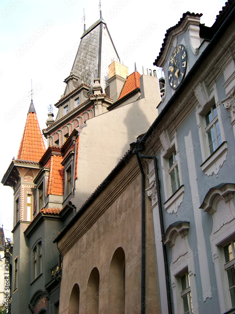 Prague typical street multistylistic architecture. Facades and roof angles crossing
