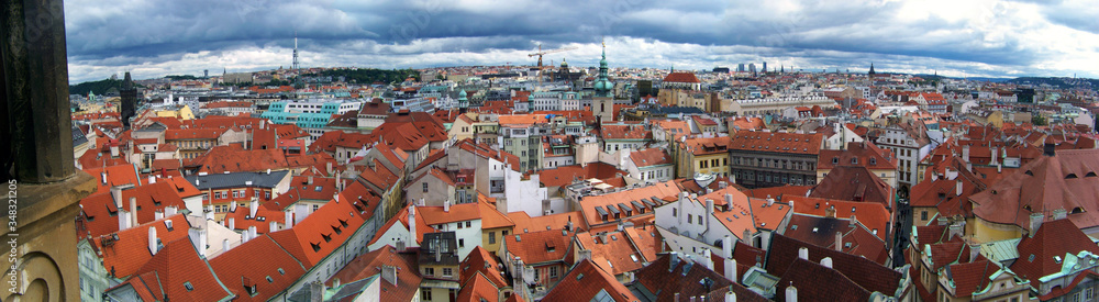 The Prague panorama with many famous city sights, historic architecture, red roof