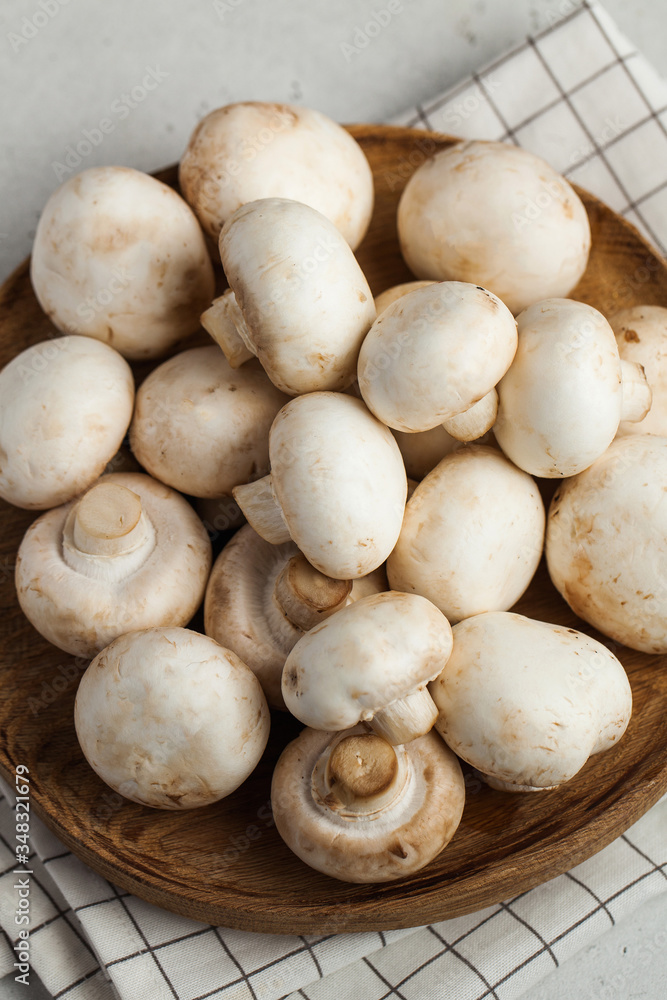 Fresh porcini mushrooms on a wooden plate close-up. Food for vegetarians. copy space. Ingredients Fresh porcini mushrooms on a wooden plate close-up. Food for vegetarians. copy space. Ingredients