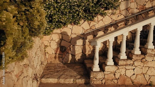 a girl in a dress running down the stairs