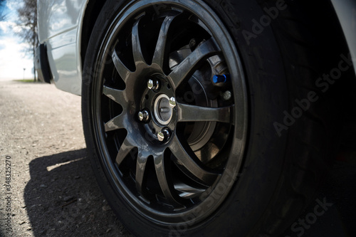 dark gray titanium car wheel © yurii oliinyk