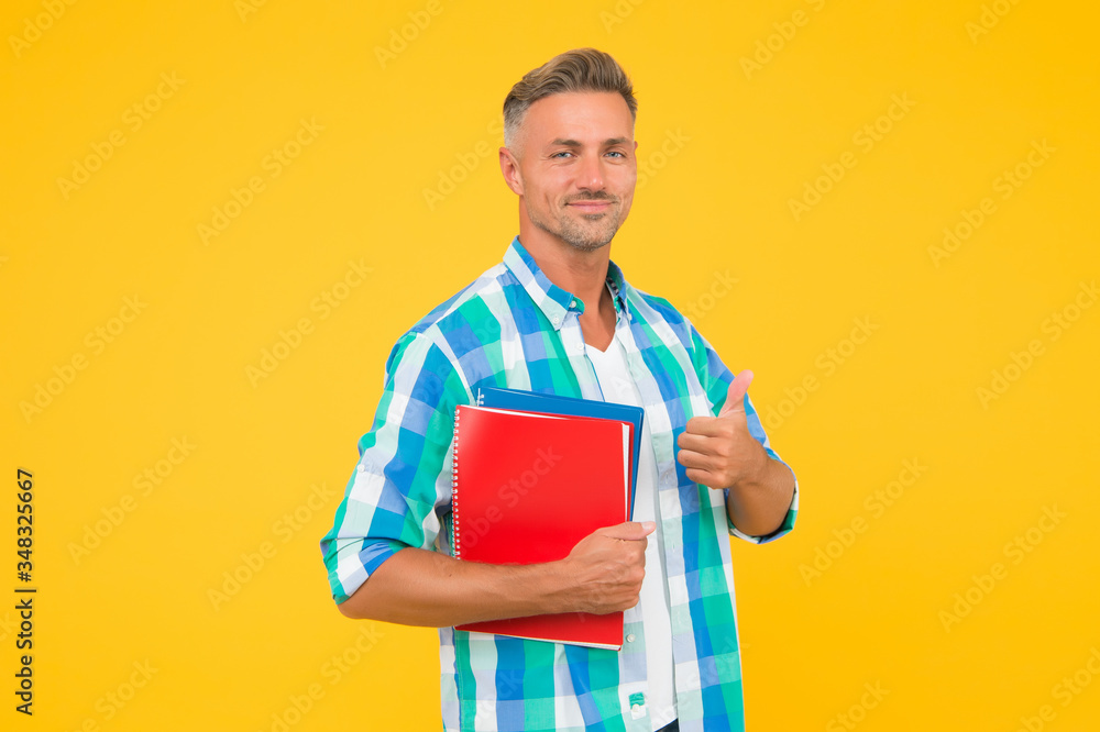 Free courses. Keep learning. College university education. Man adult student. Graduation concept. Dedicated to studying. Student with textbooks. Regular student carry workbooks. Student life Free courses. Keep learning. College university education. Man adult student. Graduation concept. Dedicated to studying. Student with textbooks. Regular student carry workbooks. Student life