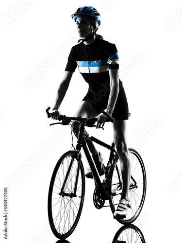 Fototapeta Naklejka Na Ścianę i Meble -  cyclist cycling riding bicycle woman isolated silhouette