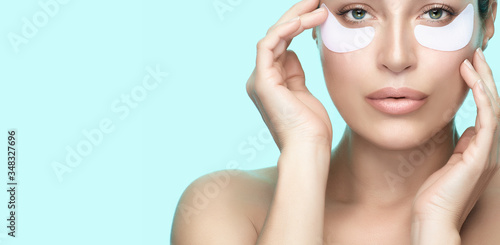 Eye Therapy Patch. Healthy Skin Woman With Perfect Clean Skin Using Under Eye Patches.