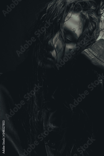 monochrome fashion portrait of a young girl, with wet hair