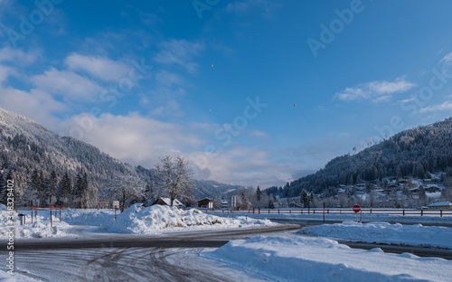 Colorful hot-air balloons flying over the mountain in Eben Im Pongau, Austria. January 2020