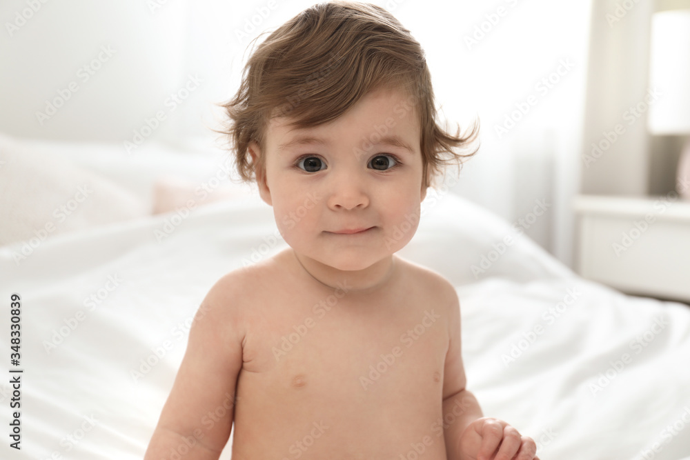 Adorable little baby on bed. Cute child