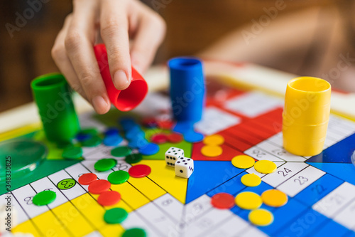 Hand throwing two dices playing Parcheesi, Parchis game photo