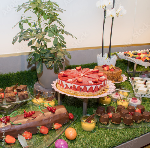 Large assortment of desserts, muffins, cakes, tarts. Candy bar during wedding reception or brunch