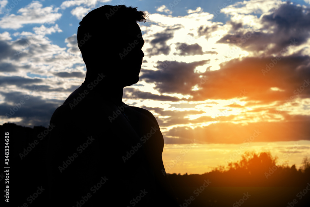 Male profile silhouette on sunset sky background. Male profile silhouette on sunset sky background.