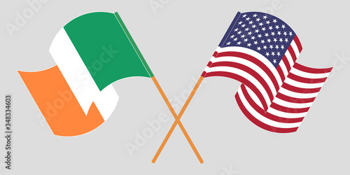 Crossed and waving flags of Ireland and the USA