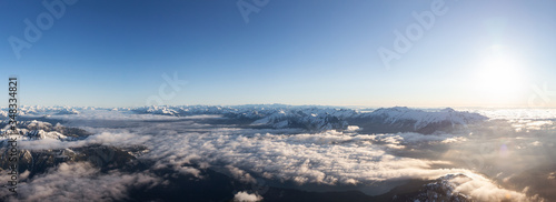 Aerial Panoramic View of Remote Canadian Mountain Landscape during sunny sunrise. Located near Vancouver  British Columbia  Canada. Nature Panorama Background. Authentic