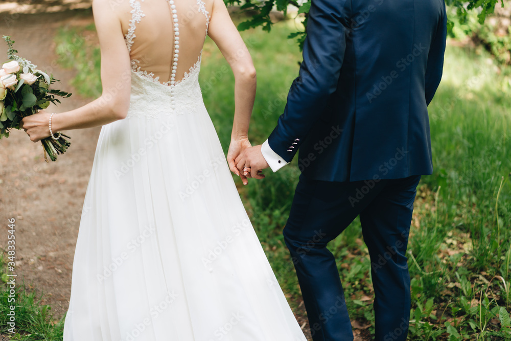 photo of a married couple walking in the forest photo of a married couple walking in the forest