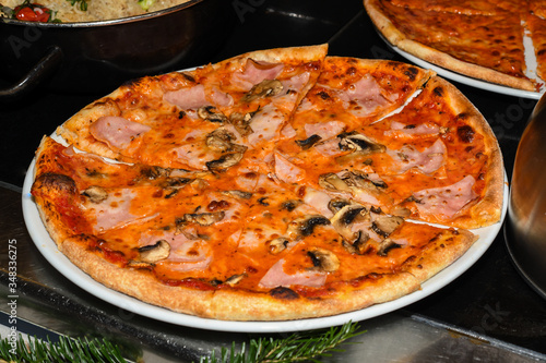 Delicious homemade Italian pizza served during brunch buffet