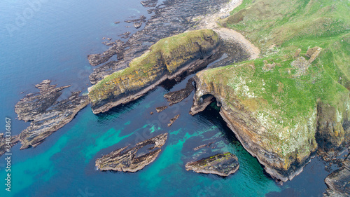 incredible ancient coastline including a sea cave and ruined castle in Caithness