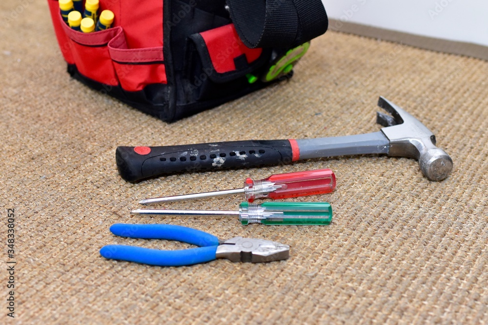 Construction tools and tool bag for simple home repairs and work projects around the house and yard Construction tools and tool bag for simple home repairs and work projects around the house and yard