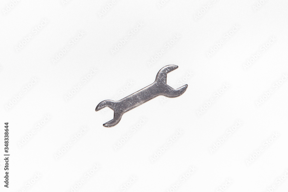 Wrench isolated on bright white background with silver color, top view Wrench isolated on bright white background with silver color, top view