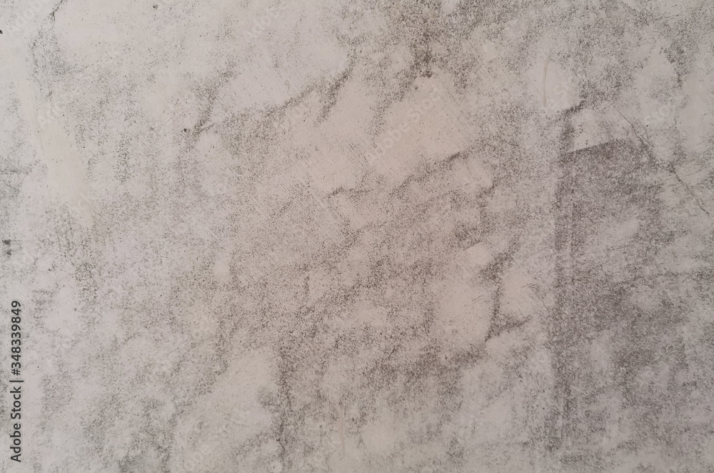 Fototapeta premium Texture of old gray concrete wall in scuffs for background.