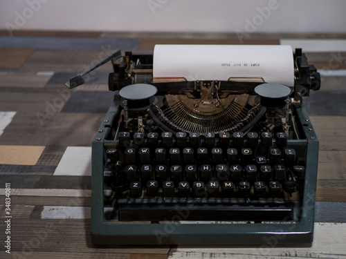 close-up text COVID 2019 NO PANIC. old vintage typewriter with a sheet of white paper