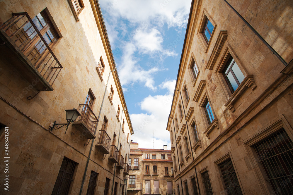 A street in the historic quarter of Salamanca (Spain), an imponent example of the sanstone architecture 