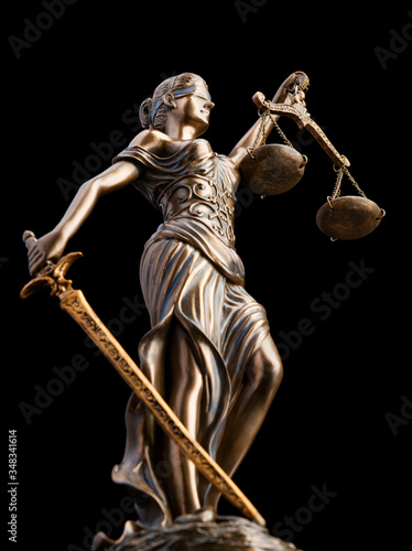 Bronze Themis statue - symbol of Justice - Isolated on black