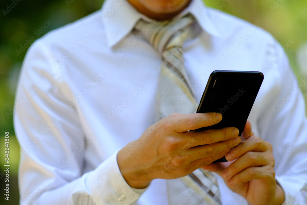 businessman using a smartphone and space for text businessman using a smartphone and space for text