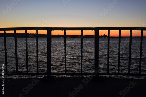 Balcony view of the East River in NYC during sunset on a beautiful spring day © CKG