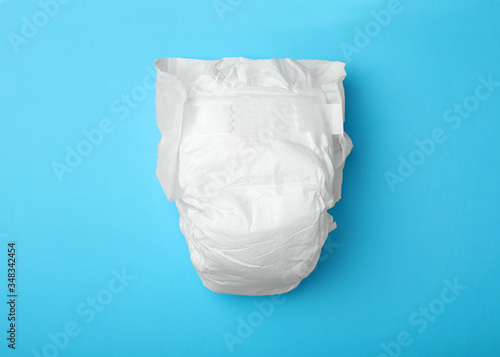 Baby diaper on light blue background, top view © New Africa