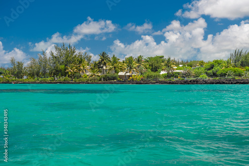 Fototapeta Naklejka Na Ścianę i Meble -  Tropical island beach palm trees cloudy blue sky landscape