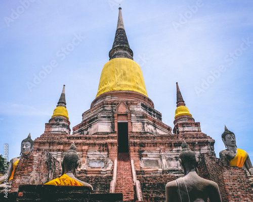 Fotografie Ancient temple with enormous pagoda at Ayutthaya Historical Park covers the ruins city of Ayutthaya, Landscape of old capital city and the famous temple of the equivalent human in Thailand