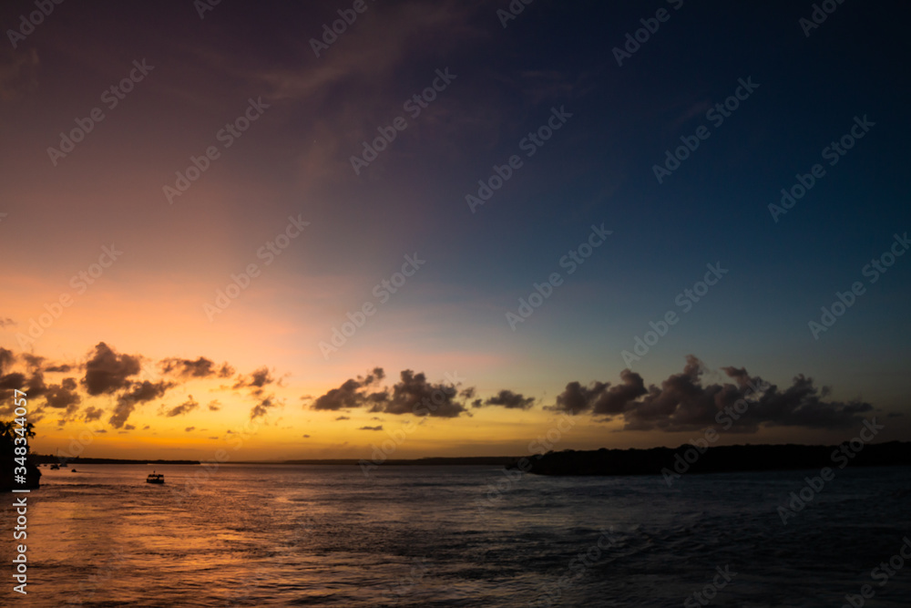 Fototapeta premium Beautiful and stunning sunset in the lagoon. The sky with orange and gold colors.