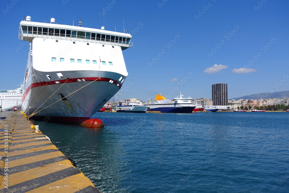 Photo of anchored passenger ferries in busy port of Piraeus on a spring morning, Attica, Greece