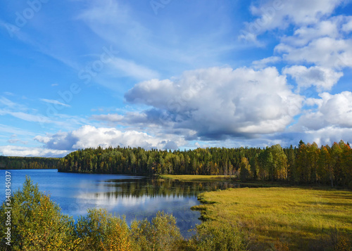 Beautiful landscape with a quiet forest lake in the time of Golden autumn. Russia, East Karelia