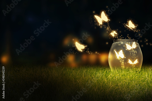 Glowing bug firefly, butterfly coming out of a jar