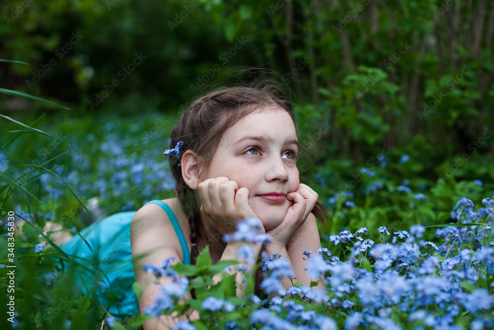 Portrait of girl with forget-me-nots flowers Portrait of girl with forget-me-nots flowers