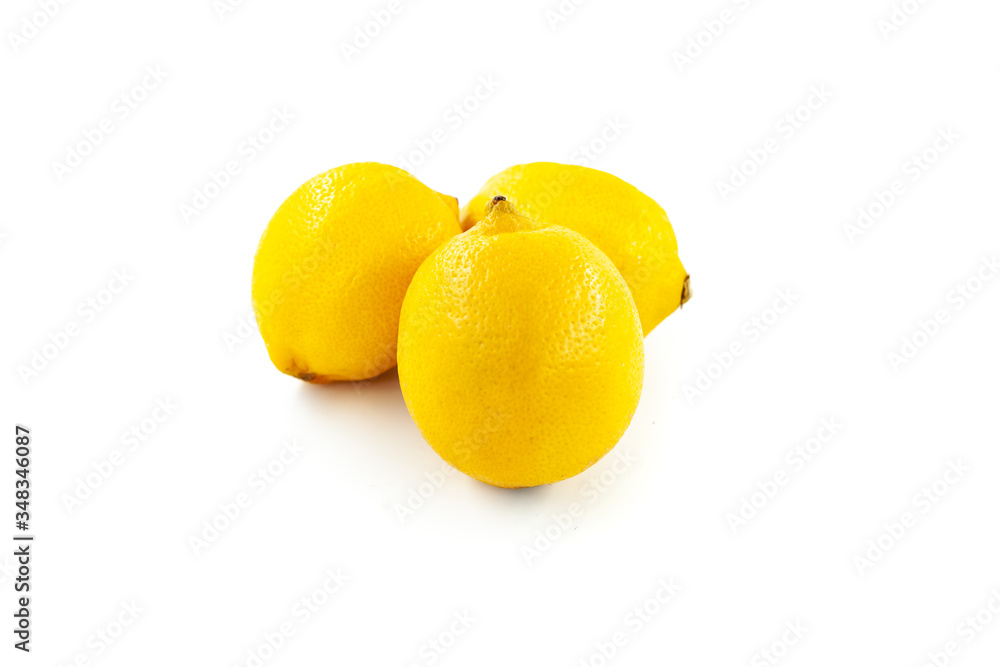 Three lemons isolated on white background. Creative healthy food concept. Flat lay. Three lemons isolated on white background. Creative healthy food concept. Flat lay.