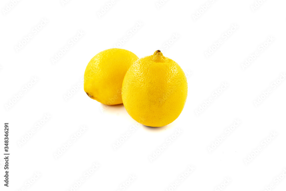 Two lemons isolated on white background. Creative healthy food concept. Flat lay.