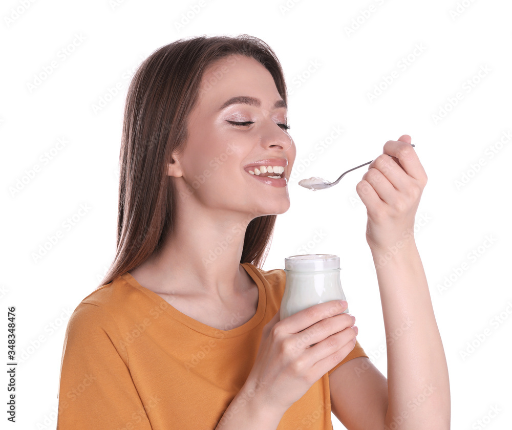 Young attractive woman eating tasty yogurt on white background Young attractive woman eating tasty yogurt on white background