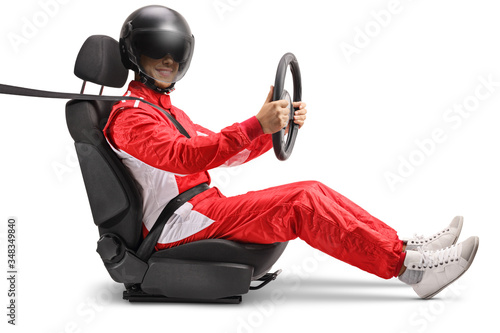 Car racer sitting in a car seat with a helmet