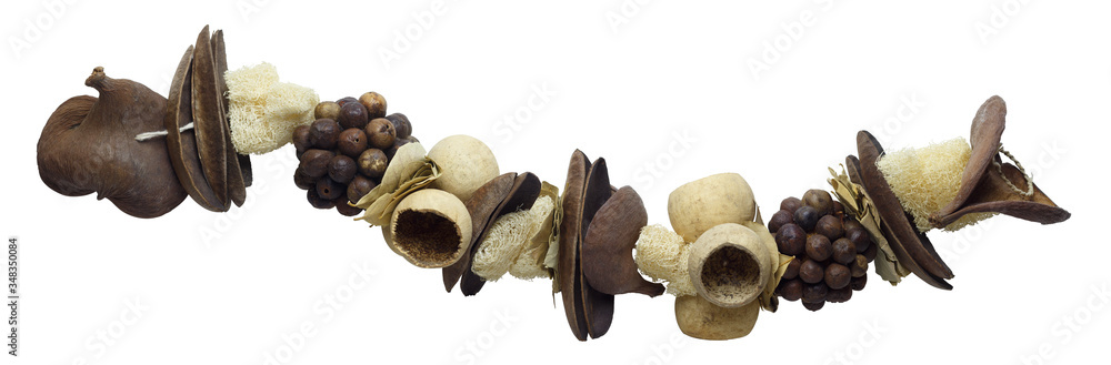 Decorative exotic garland of dried fruits and peel, isolated on a white background. Decorative exotic garland of dried fruits and peel, isolated on a white background.