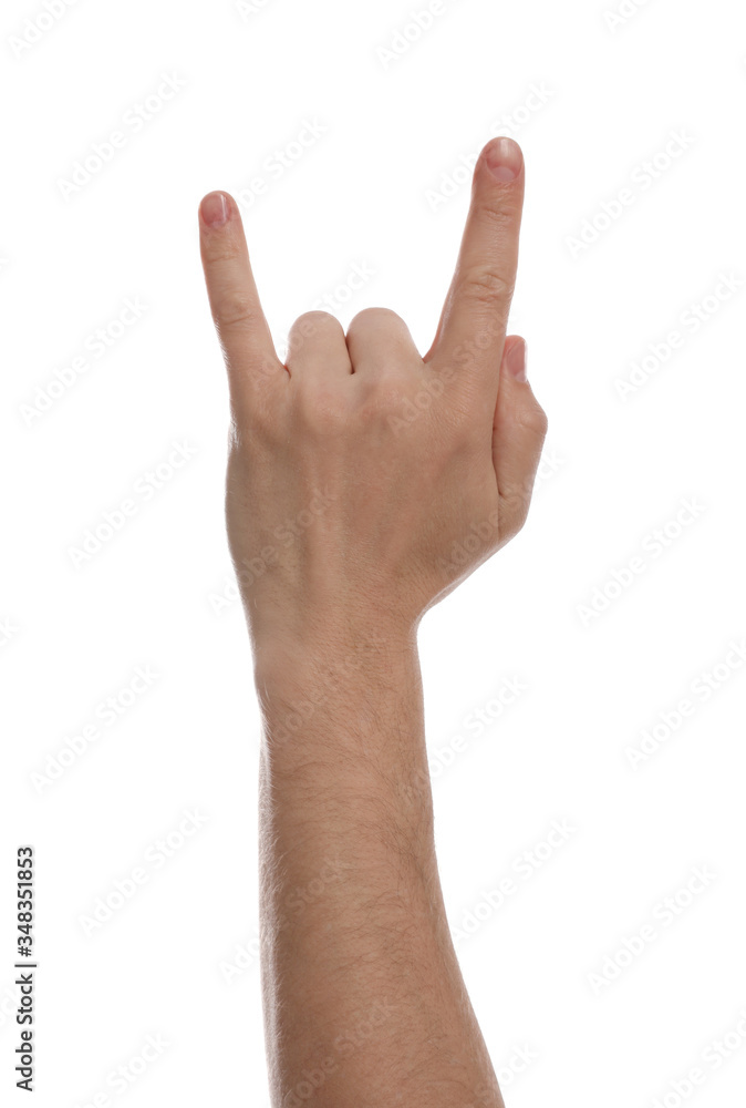 Man showing rock gesture against white background, closeup of hand Man showing rock gesture against white background, closeup of hand