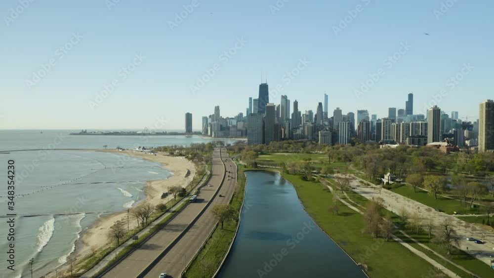 Cars Driving on Lakeshore Drive with Famous Chicago Skyline in Background, Aerial, COVID-19 Cars Driving on Lakeshore Drive with Famous Chicago Skyline in Background, Aerial, COVID-19