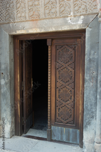 carved door to the temple in the monastery of Geghard
